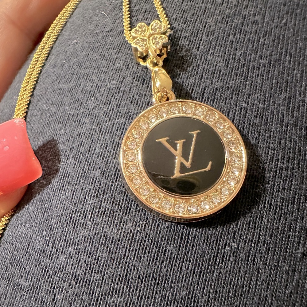 Louis Vuitton zipper pull charm on a brilliant